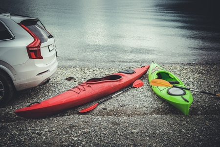 Summer Kayaking Spot and the Rocky Beach. Sport and Recreation Theme. Norway, Europe.の写真素材