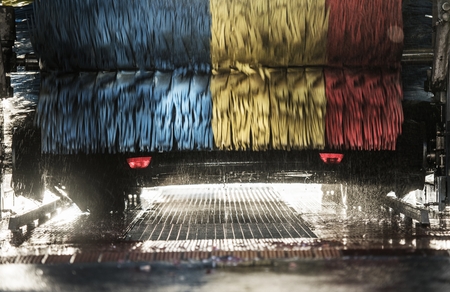 Automatic Car Wash in Progress. Spinning Colorful Brushes.の写真素材