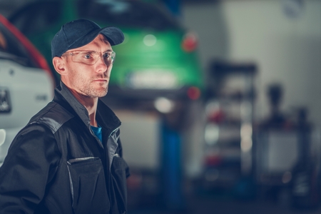 Car Mechanic Portrait. Caucasian Auto Service Worker in His 30s.の写真素材