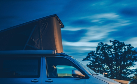 Roof Top Tent Camping. Modern Tent on the Camper Van. Travel Industry.の写真素材