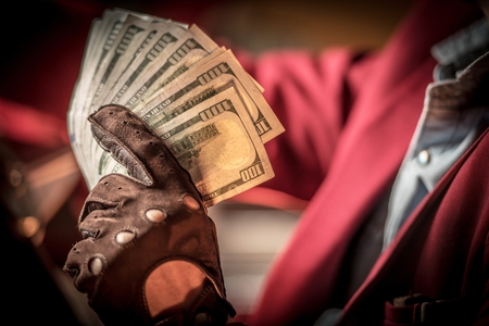Cash Money in a Hand. Hundreds of American Dollars Casino Jackpot. Gambling Concept.の写真素材