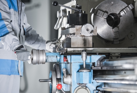 Metalwork Lathe Machine Operator. Industrial Theme. Modern Technologies.