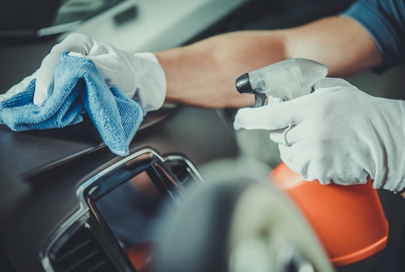 Worker Cleaning Car Dashboard. Taking Care of Vehicle Interior. Automotive Services.の写真素材