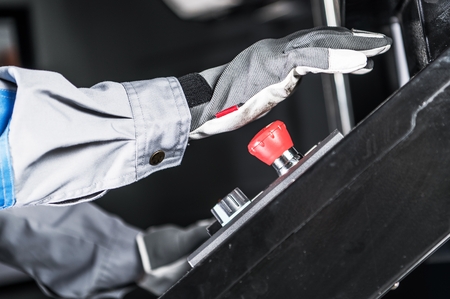 Emergency Machine Stop Button. Industrial Safety Features.