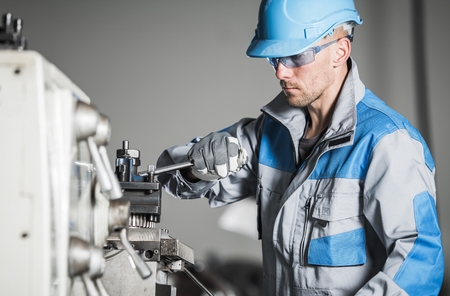 Caucasian Industrial Worker. Metalworking Industry. Lathe Operator.
