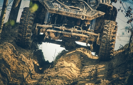 Off Road Expedition Vehicle on the Muddy Forest Trail. Extreme Motorsport.
