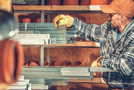 Caucasian Construction Contractor Looking For the Right Steel Framing Elements For the Job....