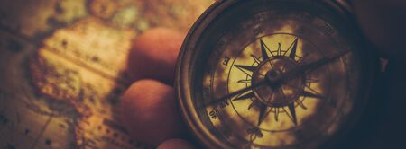 Vintage Travel Concept Banner with Compass and Old World Map. Journey West Backdrop.の写真素材