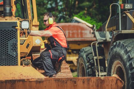 Broken Bulldozer Issue. Professional Heavy Duty Machinery Repair Technician on a Duty.