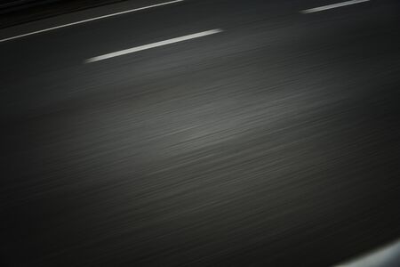 Highway Pavement Motion Blurred. Road Trip Concept Background.