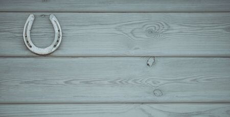 Wooden Wall with Horseshoe. Ranch and Horse Theme Photo Background.の写真素材
