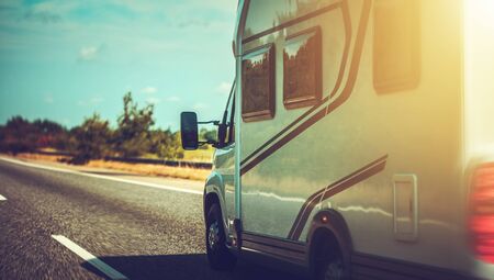 Camper Van Recreational Vehicle Summer Road Trip. Vehicle on a Highway.の写真素材