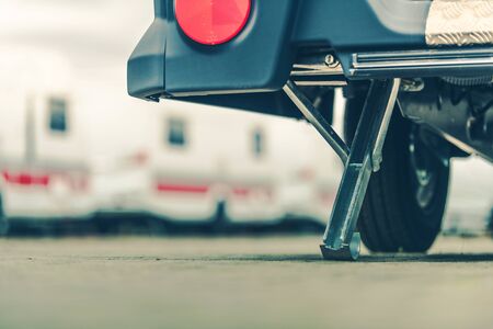 Travel Trailer Leveling and Support Leg Closeup. Caravaning and RVing Concept Photo.