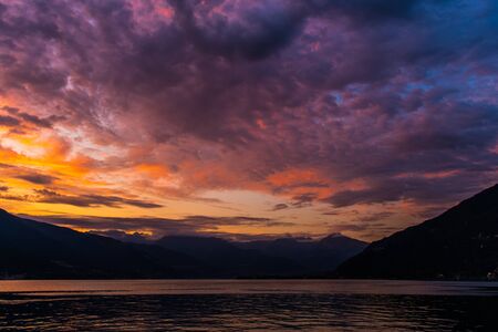Scenic Lake Como Sunset. Photo Taken From the City of Bellano Waterfront Promenade. Italian Famous Destination.の写真素材