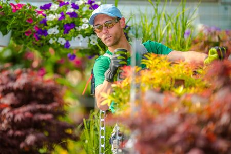 Caucasian Garden Store Department Worker in His 30s. Agriculture and Landscaping Industry Theme.