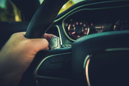 Changing Automatic Transmission Gear Using Paddle Shifters. Automotive Industry Theme. Driving Concept.の写真素材