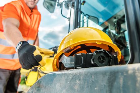 Hard Hat Industrial Zone. Caucasian Worker and Yellow Head Safety Helmet. Construction Industry...