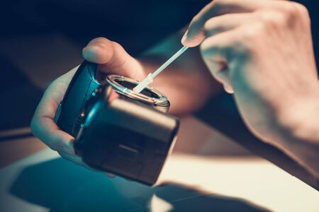 Modern Digital Camera Sensor Cleaning  by Professional Technician. Photography and Videography Equipment Maintenance.の写真素材