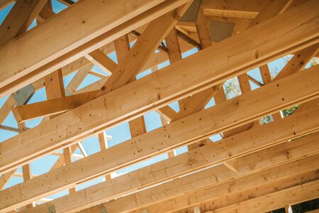 Wooden Roof Construction Beams Closeup Photo. Construction Industry Theme. の写真素材
