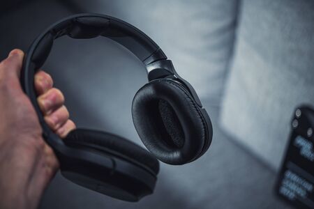 Large Professional Wireless Headphones in Hands. Audio Listening Equipment.の写真素材