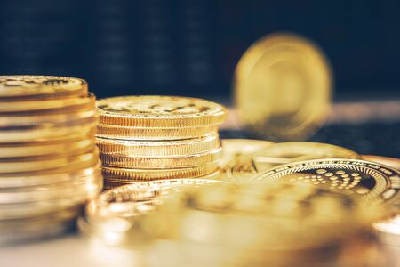 Golden Cryptocurrency Coins Macro Closeup Photo. Pile of Coins. Business Theme.の写真素材