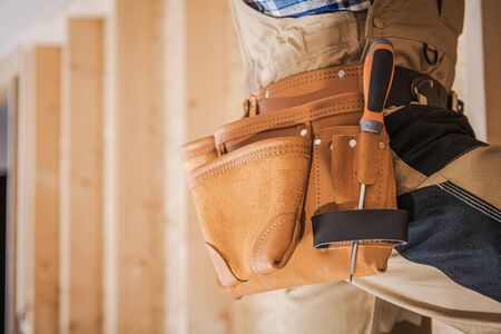 Home Improvement Job. Residential Construction Contractor and His Tools Belt Closeup Photo. の写真素材