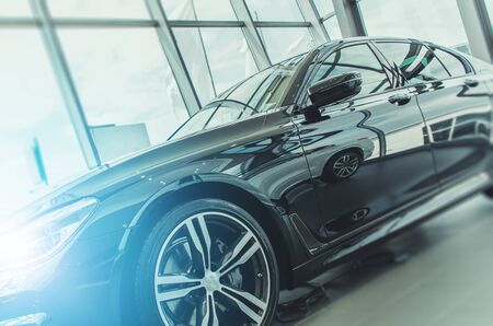 Dealership Showroom Modern Car on Display. Automotive Industry Theme.の写真素材
