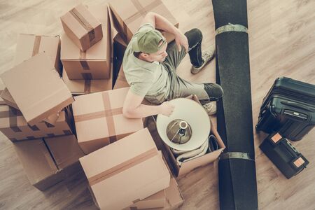 Moving Out Of Old House WIth Last Packages And Items Left To Transport.