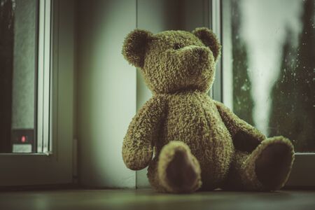 Close Up Of Teddy Bear Toy Placed By Window In Bedroom. の写真素材