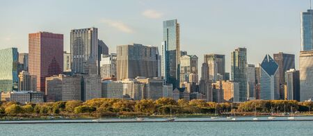 Panoramic Cityscape View Of Urban Area With Many Tall Buildings Park Body Of Water And Boats. 