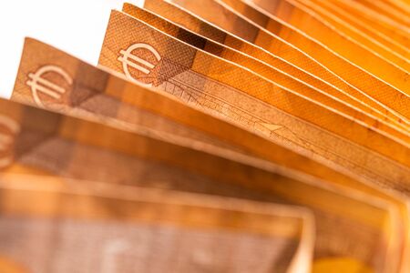 Close Up Of Neat Stack Of Orange European Foreign Currency Paper Bills. の写真素材