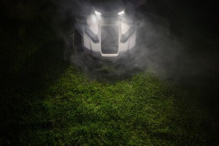 Late Evening Hours Grass Field Mowing Using Modern Wireless Electric Mowerの写真素材
