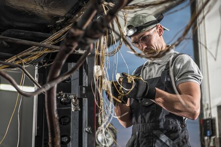 Transportation Industry Theme. Coach Bus Electric Installation Replacement by Caucasian Bus Electric...