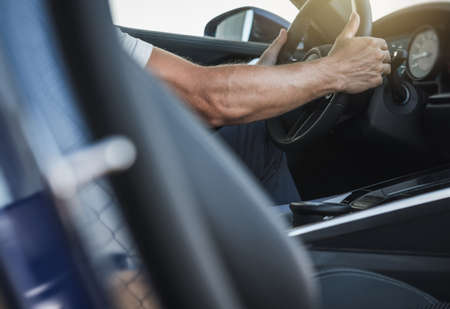 Caucasian Car Dealership Client Testing Brand New Vehicle Interior. Automotive Sales Theme. Transportation Industry.の写真素材