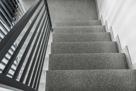 New Residential Stairs and Metal Rails Inside Apartments Building. Construction and Interior Finishing Theme.の写真素材