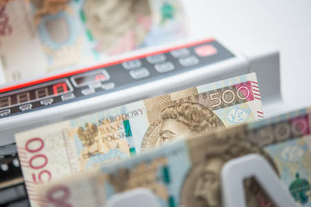 Currency in the Republic of Poland. Five Hundred Polish Zloty Banknotes Inside Bank Counting...