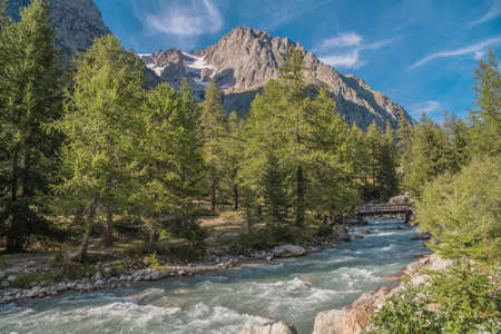 Scenic Italian Alps Summer Landscape with Mountain River. Eastern Sides of the Mont Blanc Massif.の写真素材