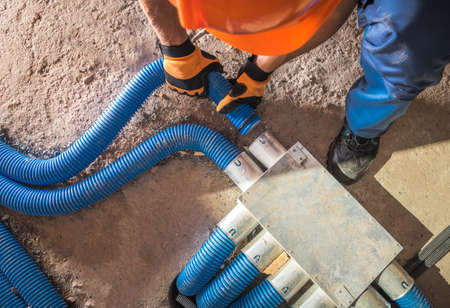 Industrial Theme. Modern Floor Hidden Air Circulation and Climate Control Pipeline Installation....
