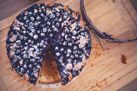 Fresh Baked Blueberries Cake Tasty Dessert on Wooden Board Top View