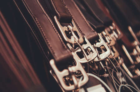 Genuine Leather Belts Hanging on a Rack in Retail Store. Leather Products Line.の写真素材