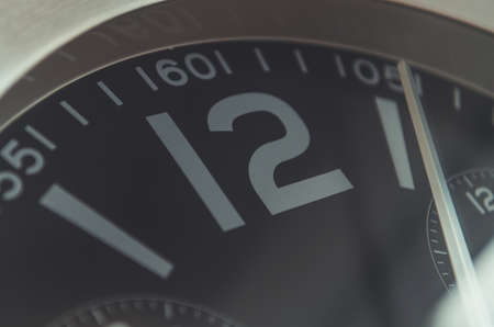 Close up of twelve o'clock wall clockの写真素材