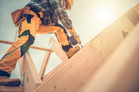 Caucasian Contractor Worker in His 40s with Drill Driver in His Hand. Carpenter Working on Wooden...