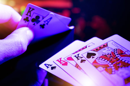Full House Poker Theme. Caucasian Players Hand Close Up with Right Cars in His Hands To Get Full...