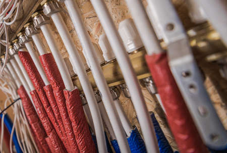 Cold and Hot Water Valves Inside Wooden Built Residential Building. HVAC Theme.の写真素材