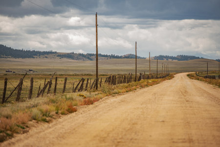 Rural Colorado Gravel Road and Cloudy Landscape near Town of Fairplay, Colorado, United States of America.の写真素材