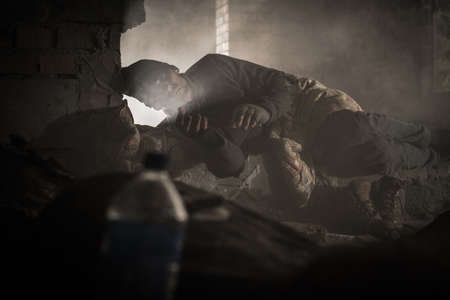 Homeless Caucasian Men in His 40s Sleeping Inside House Ruins.