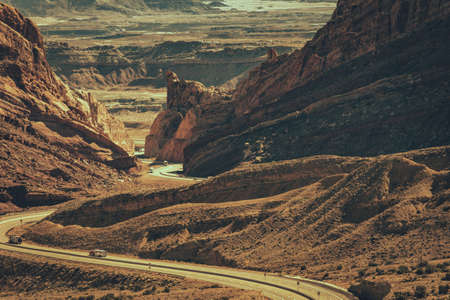 Scenic Utah Interstate 70 Highway. Sandstone Rock Formations Scenery and the Road Crossing the Raw Landscape.の写真素材