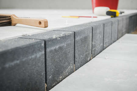 Industrial Theme. Building Concrete Bricks Pathway with Different Levels Close Up.の写真素材