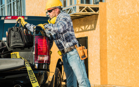 Caucasian Middle Aged Worker Just Arrived at the Residential Building Construction Site Taking Tool...