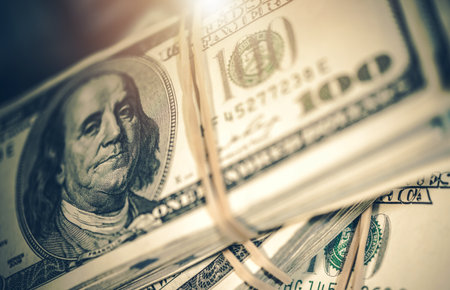 Closeup of One Hundred Dollar Bills Wrapped with Twine. American Currency in Cash. Financial...